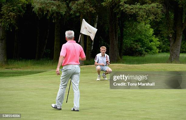 Bruce Whipham of Kirby Muxloe Golf Club and Joseph Halfpenny of Kirby Muxloe Golf Club line up a putt on the 16th green during the PGA National...