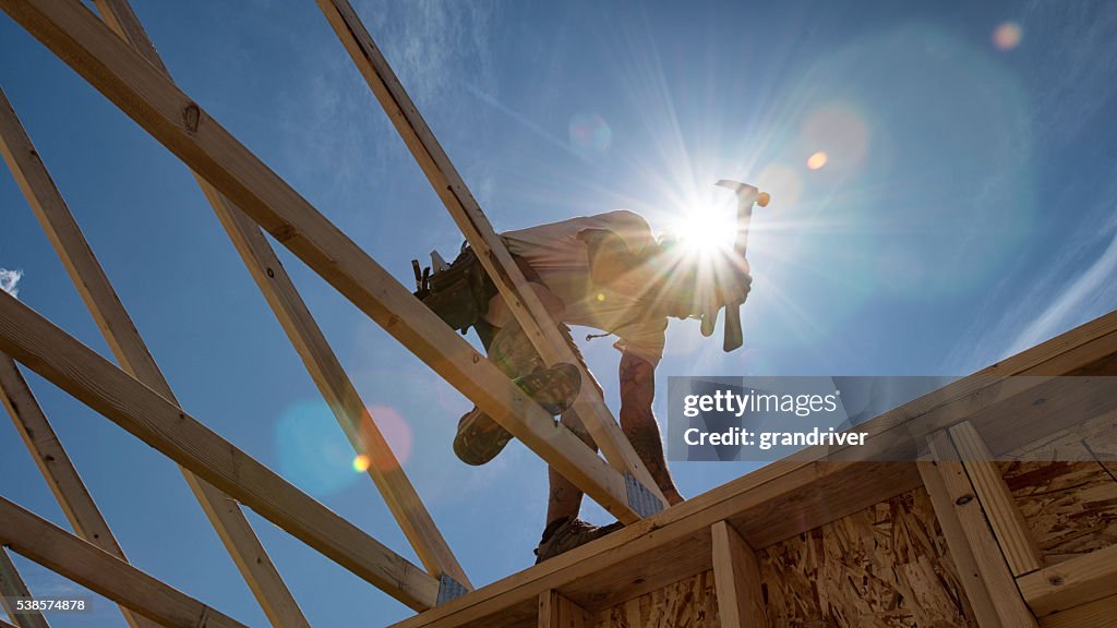 Construction Worker Framing A Building