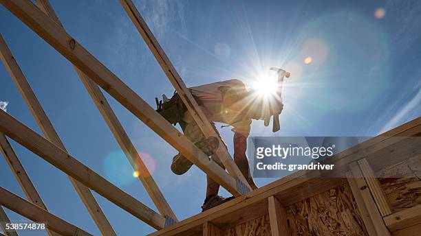 construction worker framing a building - snickeriarbete bildbanksfoton och bilder