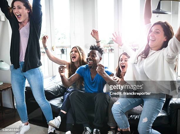 group of college student happiness on the sofa - sport event stock pictures, royalty-free photos & images
