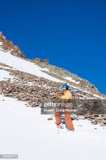 a male skier hikes to his ski line at big sky resort in big sky, montana. - big sky ski resort stock pictures, royalty-free photos & images