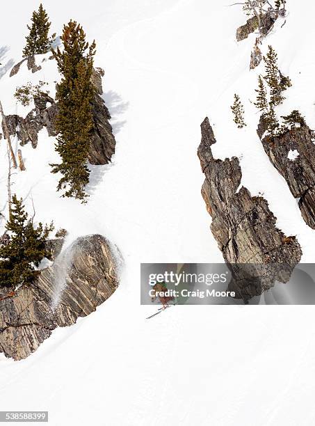 a male backcountry skier makes a powder turn in the beehive basin near big sky, montana. - basin montana bildbanksfoton och bilder