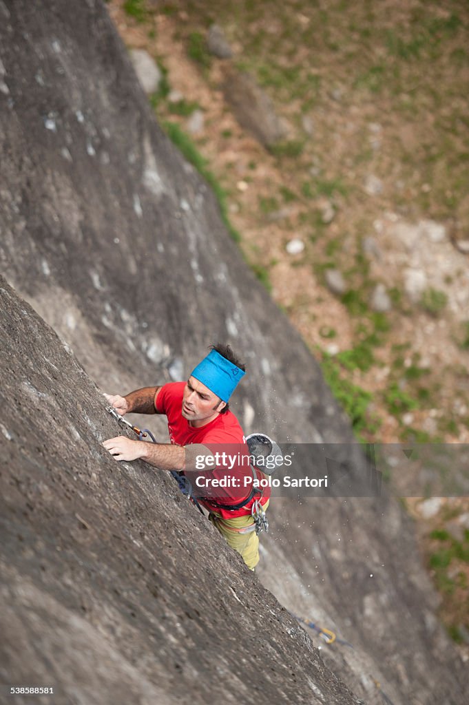 Man climbing on the granite of Premia Balmafreddas crag. Premia, Ossola, Italy.