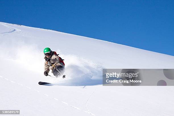 a male skier skiing untracked powder at big sky resort in big sky, montana. - big sky ski resort stock pictures, royalty-free photos & images