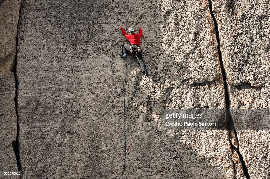 Man climbing a wall near Corbets Couloir, Jackson Hole, Wyoming.