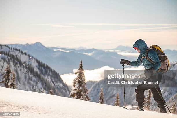 woman snowshoeing. - schneeschuhwandern stock-fotos und bilder