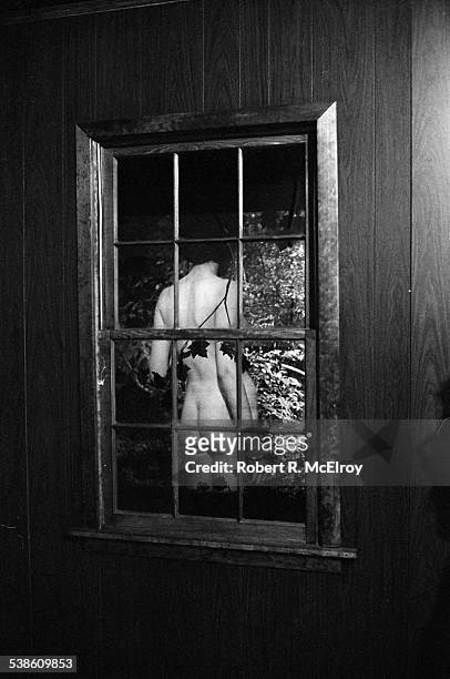 View of an unidentified, naked woman as seen through a window installation during '9 Evenings: Theatre & Engineering,' New York, New York, between...