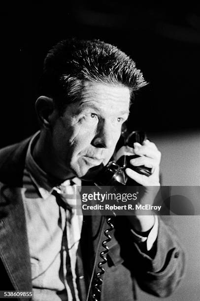 Close-up of American composer John Cage as he uses a telephone as part of his 'Variations VII' piece during '9 Evenings: Theatre & Engineering' at...