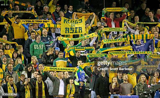 Socceroos supporters in the crowd show their support during the International Friendly match between the Australian Socceroos and Greece at Etihad...