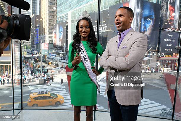 Calloway interviews Miss USA 2016 Deshauna Barber during her visit to "Extra" at their New York studios at H&M in Times Square on June 7, 2016 in New...