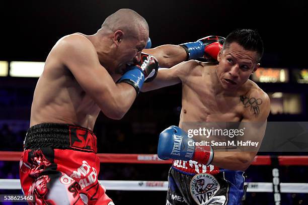 Francisco Vargas dodges a right to the head by Orlando Salido during their WBC super featherweight championship bout at StubHub Center on June 4,...