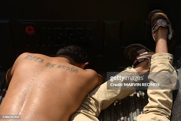 Members of the Mara Salvatrucha gang captured by soldiers during an operation to recover neighborhoods controlled by gangs, in Quezaltepeque, a town...