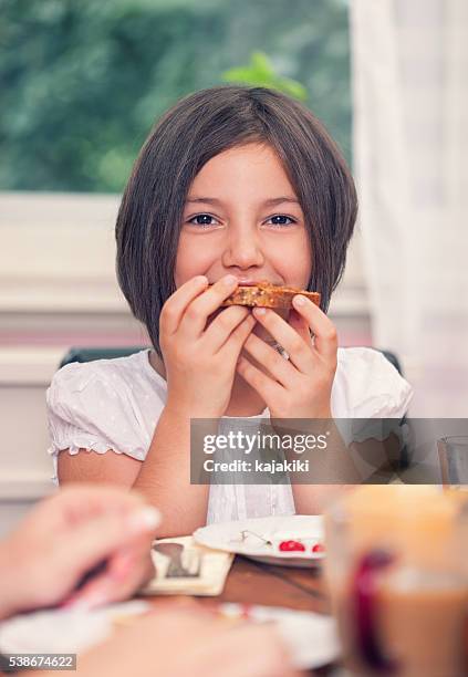 young happy family having breakfast - loaf of bread bildbanksfoton och bilder