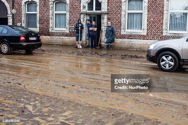 Street is filled with mud and dirt after floods caused by heavy rainfall in Rillaar, Flemish Brabant, Belgium on June 7, 2016.