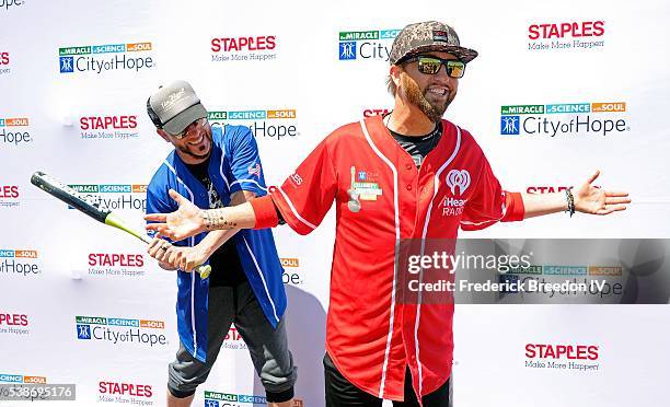 Chris Lucas and Preston Brust pose for a photo at the 26th Annual City of Hope Celebrity Softball Game at First Tennessee Park on June 7, 2016 in...