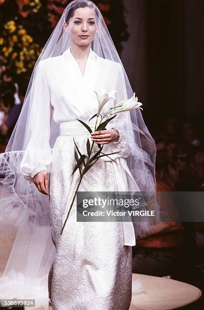 Lucie de la Falaise walks the runway at the Yves Saint Laurent Haute Couture Spring/Summer 1993 fashion show during the Paris Fashion Week in...