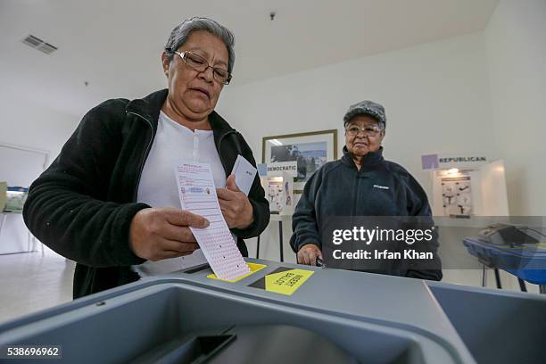 Amanda Compos left, and her mother Maria Bajan after casting their ballot as California primary voting takes place at Curry Temple Christian...