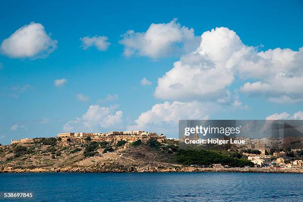 mgarr seen from sea - island of gozo mgarr stock pictures, royalty-free photos & images