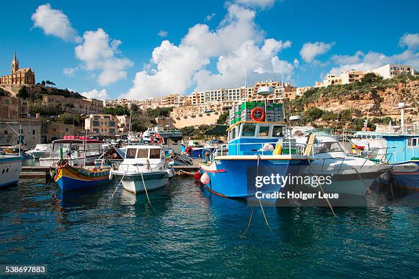 traditional fishing boats in harbor - mgarr harbour stock pictures, royalty-free photos & images