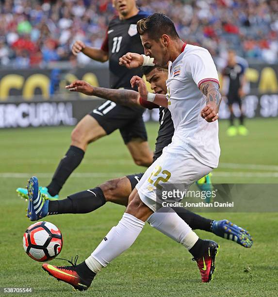 Ronald Matarrita of Costa Rica is pressured by DeAndre Yedlin of United States during a match in the 2016 Copa America Centenario at Soldier Field on...