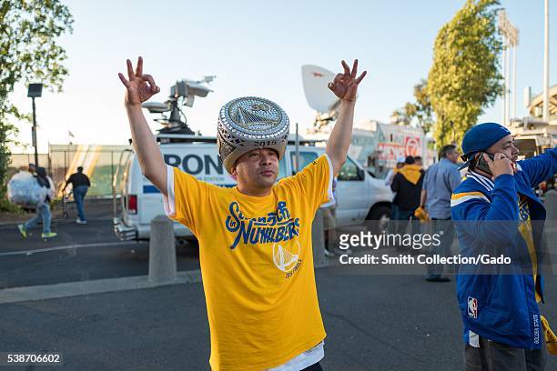 Following Game 2 of the National Basketball Association Finals between the Golden State Warriors and the Cleveland Cavaliers, a fan of the Warriors...