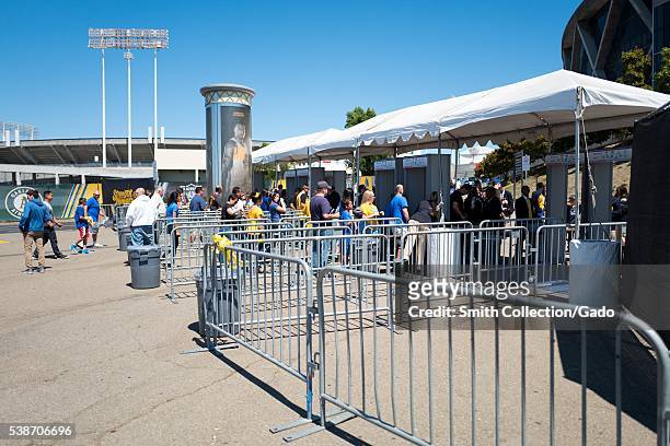 Before Game 2 of the National Basketball Association Finals between the Golden State Warriors and the Cleveland Cavaliers, fans enter metal detectors...