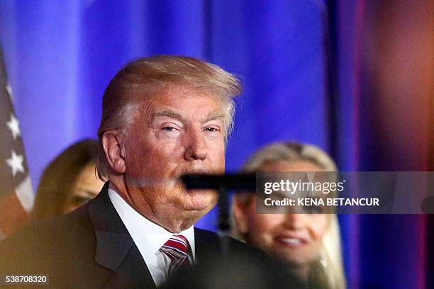 Republican presidential candidate Donald Trump looks to the teleprompter as he delivers remarks following primaries in California, Montana, New...