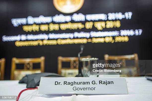 Name card for Raghuram Rajan, governor of the Reserve Bank of India , is displayed on a desk at a news conference in Mumbai, India, on Tuesday, June...