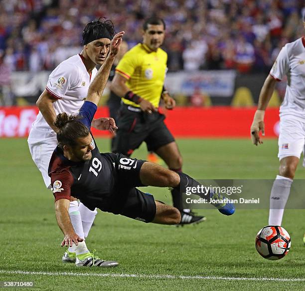 Christian Bolanos of Costa Rica takes down Graham Zusi of the United States during a match in the 2016 Copa America Centenario at Soldier Field on...