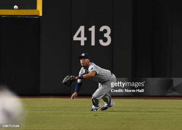 Desmond Jennings of the Tampa Bay Rays makes a diving catch against the Arizona Diamondbacks during the second inning at Chase Field on June 7, 2016...