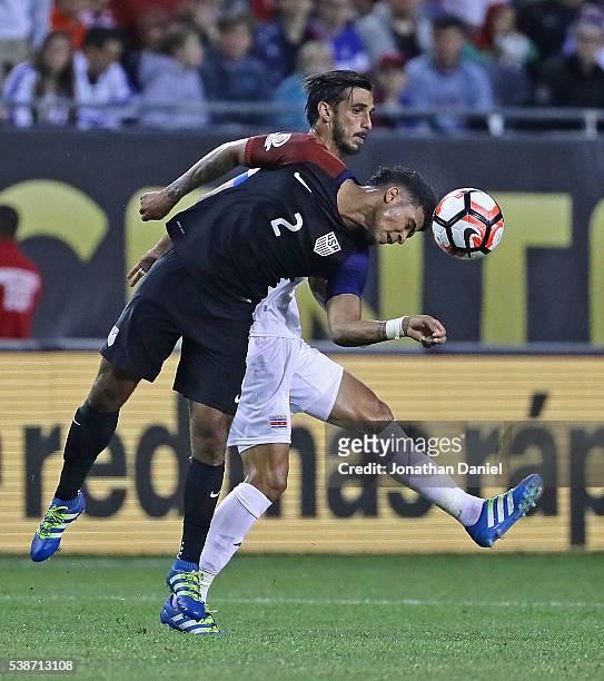 DeAndre Yedlin of the United States heads the ball away from Bryan Ruiz of Costa Rica during a match in the 2016 Copa America Centenario at Soldier...