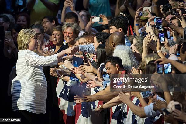 Democratic presidential candidate Hillary Clinton greets supporters on her way to arrive onstage during a primary night rally at the Duggal...