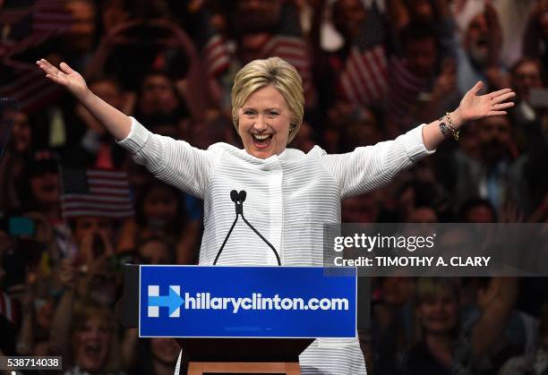 Democratic presidential candidate Hillary Clinton celebrates on stage during her primary night event at the Duggal Greenhouse, Brooklyn Navy Yard,...