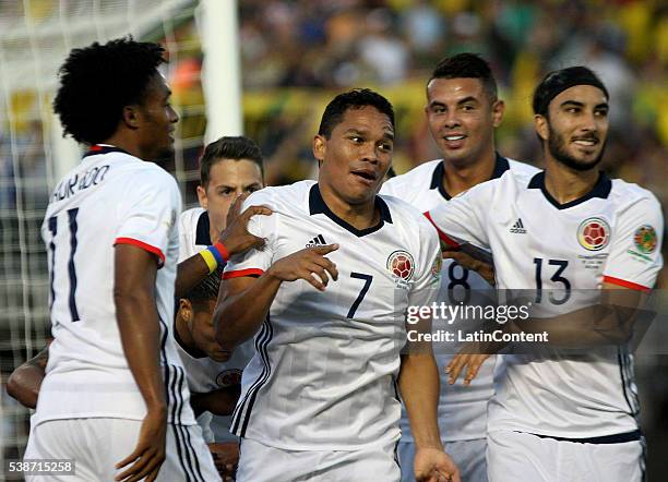 Carlos Bacca of Colombia celebrates with teamamtes after scoring the opening goal during a group A match between Colombia and Paraguay at Rose Bowl...