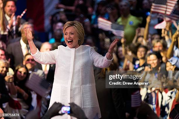 Democratic presidential candidate Hillary Clinton arrives onstage during a primary night rally at the Duggal Greenhouse in the Brooklyn Navy Yard,...