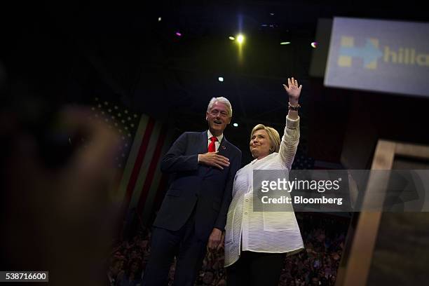 Hillary Clinton, former Secretary of State and presumptive Democratic presidential nominee, right, and husband Bill Clinton, former U.S. President,...