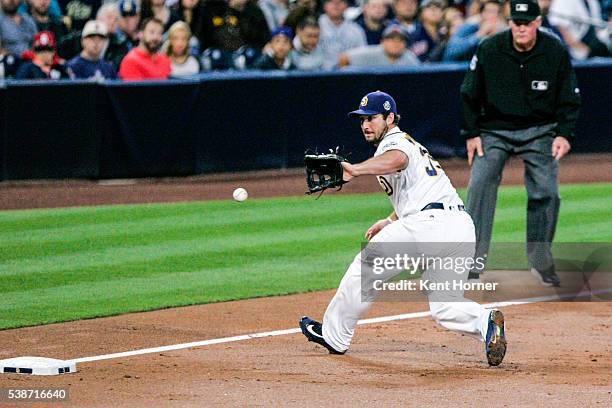 Brett Wallace of the San Diego Padres fields the ball in the 4th inning against the Atlanta Braves at PETCO Park on June 7, 2016 in San Diego,...