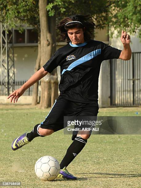 In this photograph taken on May 4 Pakistani national cricket and football player Diana Baig takes part in a football training session at a ground in...