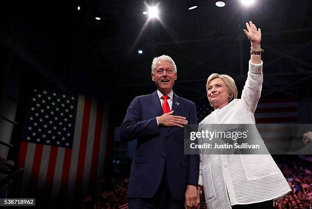 Democratic presidential candidate former Secretary of State Hillary Clinton and her husband former U.S. President Bill Clinton greet supporters...