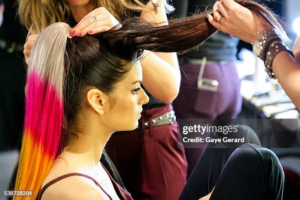 Model prepares in makeup and hair backstage ahead of the FW Trends Runway as part of the Mercedes Benz Fashion Festival Sydney 2012 at Sydney Town...