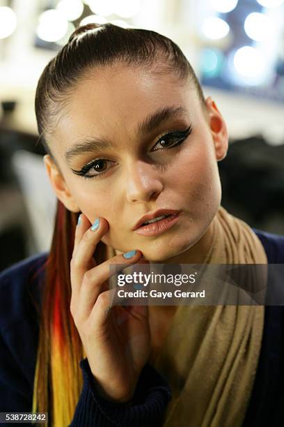 Model poses backstage ahead of the FW Trends Runway as part of the Mercedes Benz Fashion Festival Sydney 2012 at Sydney Town Hall on August 21, 2012...