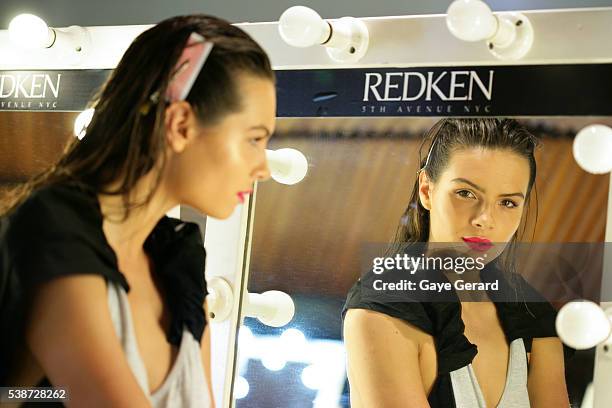 Model poses backstage ahead of the FW Trends Runway as part of the Mercedes Benz Fashion Festival Sydney 2012 at Sydney Town Hall on August 21, 2012...