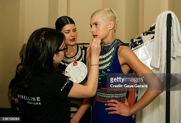 Model prepares in makeup and hair backstage ahead of the FW Trends Runway as part of the Mercedes Benz Fashion Festival Sydney 2012 at Sydney Town...