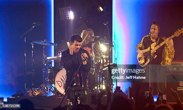 Singer Joe Jonas, drummer Jack Lawless and bassist Cole Whittle of DNCE perform at Time Warner Cable Arena on June 7, 2016 in Charlotte, North...