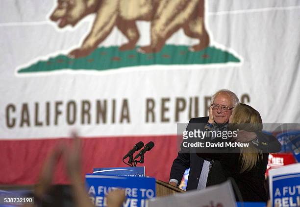 Democratic presidential candidate Senator Bernie Sanders gets a kiss from his wife Jane O'Meara Sanders at his California primary election night...