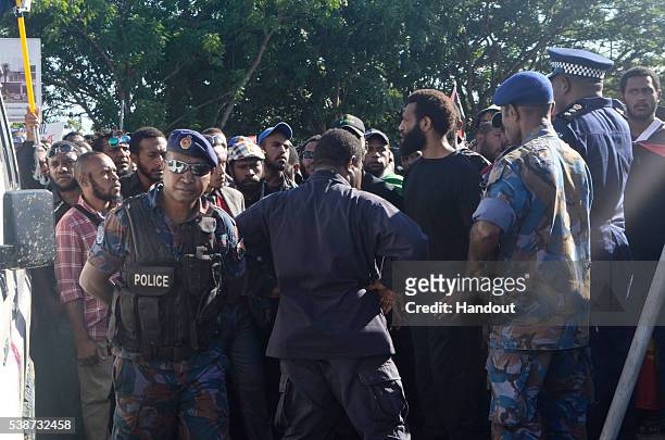 In this handout image provided by PNGFM News, protesters and police are seen during an anti-government protest at the University of Papua New Guinea...
