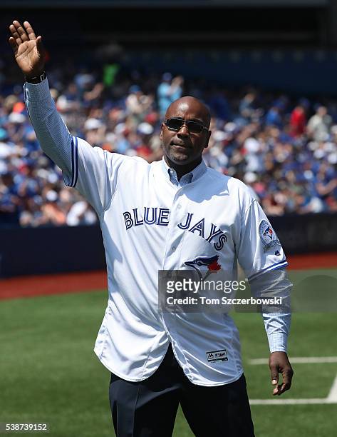 Former player Carlos Delgado of the Toronto Blue Jays is introduced during 40th anniversary celebrations before the start of MLB game action against...