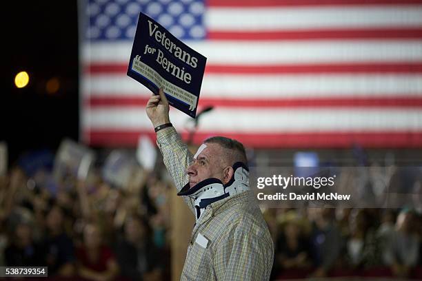 Man holds a sign at the California primary election night rally for Democratic presidential candidate Senator Bernie Sanders on June 7, 2016 in Santa...
