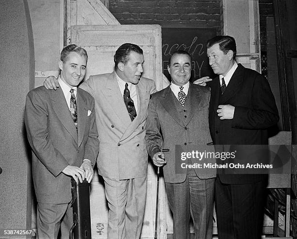 Ed Sullivan poses with billiards player Willie Mosconi, golfer Gene Sarazen and boxer Fritzie Zivic during rehearsals for "Toast of the Town" hosted...