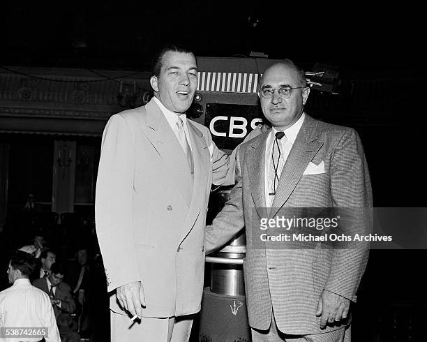 Ed Sullivan greets a guest for "Toast of the Town" hosted by Ed Sullivan at the Maxine Elliott Theater in New York, New York.